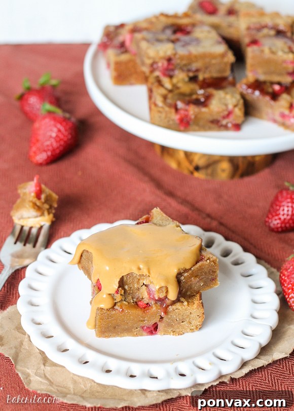 Stacked Peanut Butter & Jelly Bars, showing their delightful layers and golden-brown edges.