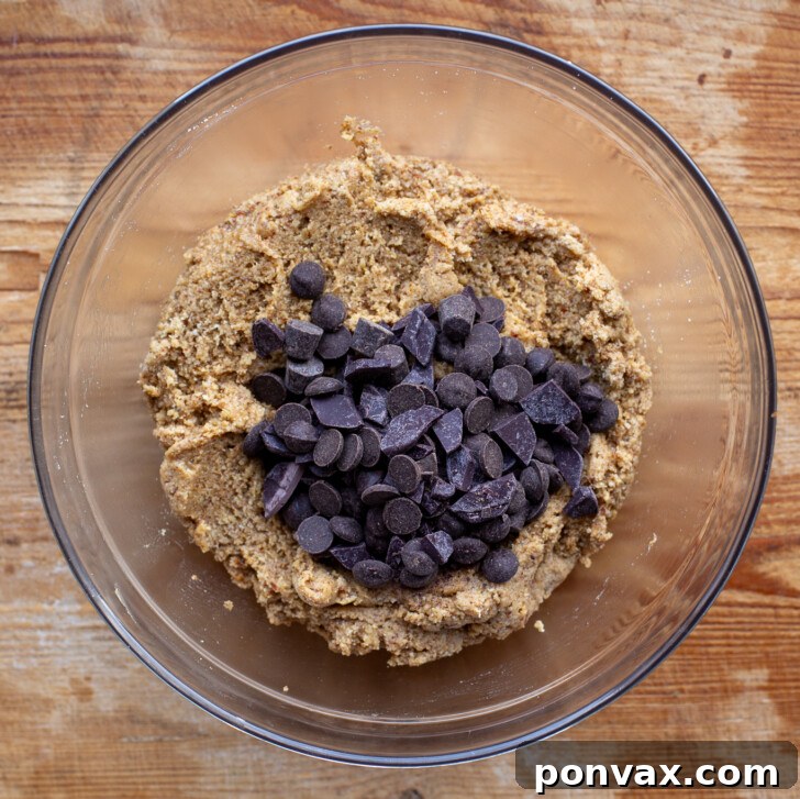 Irresistible Paleo Chocolate Chip Cookies Vegan Friendly 12 Mixing the dry ingredients into the cookie dough.