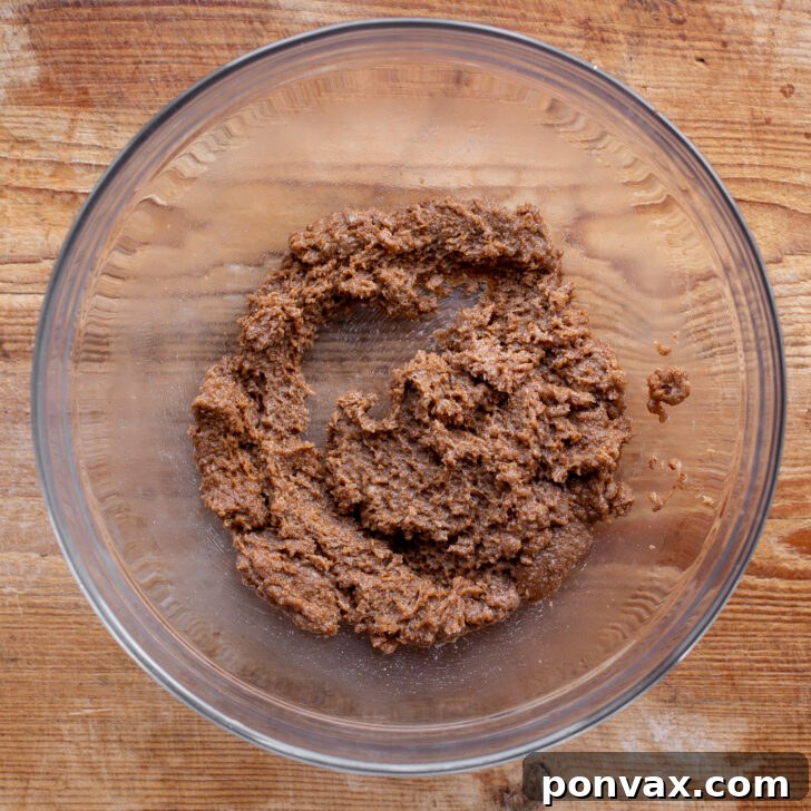 Irresistible Paleo Chocolate Chip Cookies Vegan Friendly 8 Creamed coconut oil and coconut sugar in a bowl.