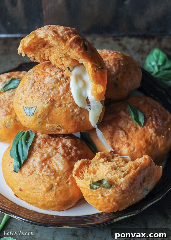 These delectable Cheesy Tomato Basil Rolls vanish quickly! Enjoy them warm with melted mozzarella or get creative by using the dough for savory sandwiches like a gourmet BLT.