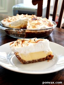 Zesty Lime Cloud Pie 2 Key Lime Meringue Pie with a fluffy, golden meringue top.