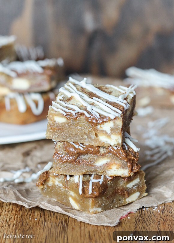 These Browned Butter White Chocolate Blondies with CookieNut Butter Swirl are quick, easy, and delicious! They come together in one bowl, and you'll love the unique CookieNut Butter swirl.
