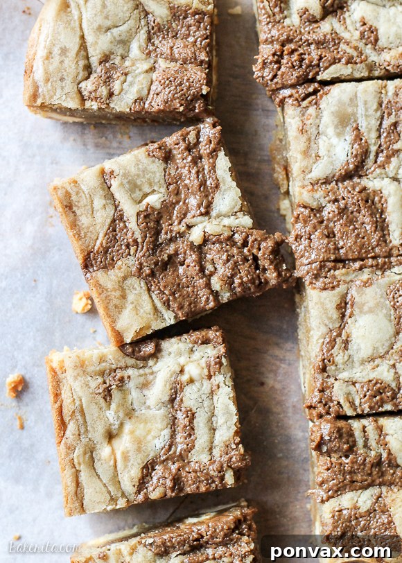 These Browned Butter White Chocolate Blondies with CookieNut Butter Swirl are quick, easy, and delicious! They come together in one bowl, and you'll love the unique CookieNut Butter swirl.