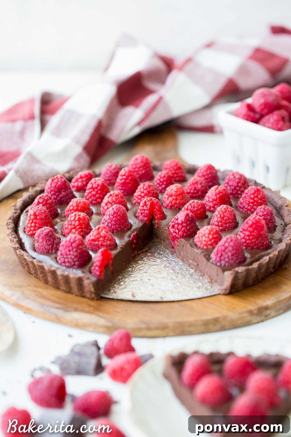 Silky Vegan No-Bake Raspberry Chocolate Tart 4 The No-Bake Raspberry Chocolate Tart with freshly poured ganache, ready for the raspberry topping, showcasing its smooth and glossy texture.