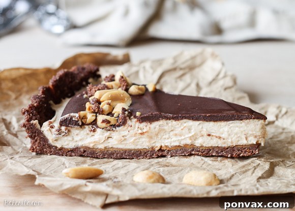 This No Bake Chocolate Peanut Butter Tart has a rich peanut butter filling topped with chocolate ganache for a decadent treat you won't believe is gluten free, refined sugar free, and vegan!