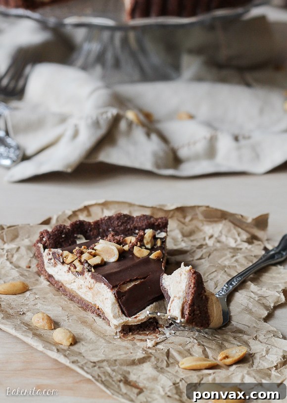 This No Bake Chocolate Peanut Butter Tart has a rich peanut butter filling topped with chocolate ganache for a decadent treat you won't believe is gluten free, refined sugar free, and vegan!