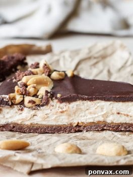 This No Bake Chocolate Peanut Butter Tart has a rich peanut butter filling topped with chocolate ganache for a decadent treat you won't believe is gluten free, refined sugar free, and vegan!