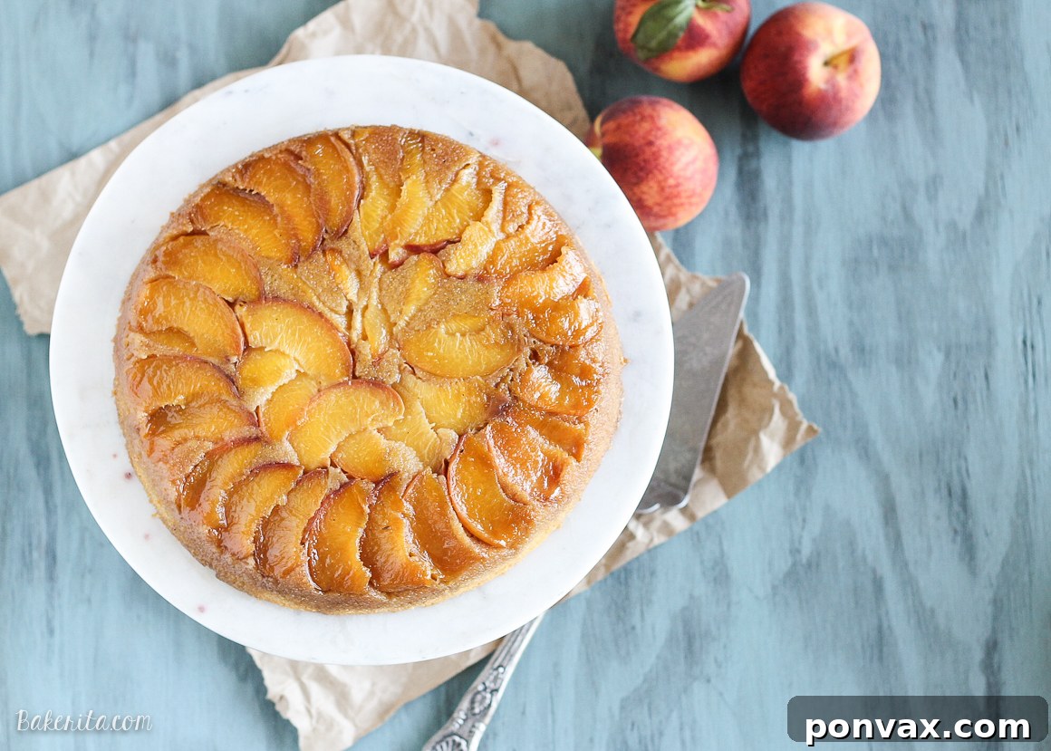 Golden Peach Cornmeal Upside Down Delight 3 A whole Peach Cornmeal Upside Down Cake, beautifully presented, ready to be sliced.