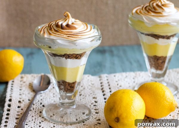 These Lemon Meringue Pie Parfaits are a no-bake dessert that will be your new summer favorite! Lemon curd, graham cracker crumbs, and meringue makes the best individual treats.