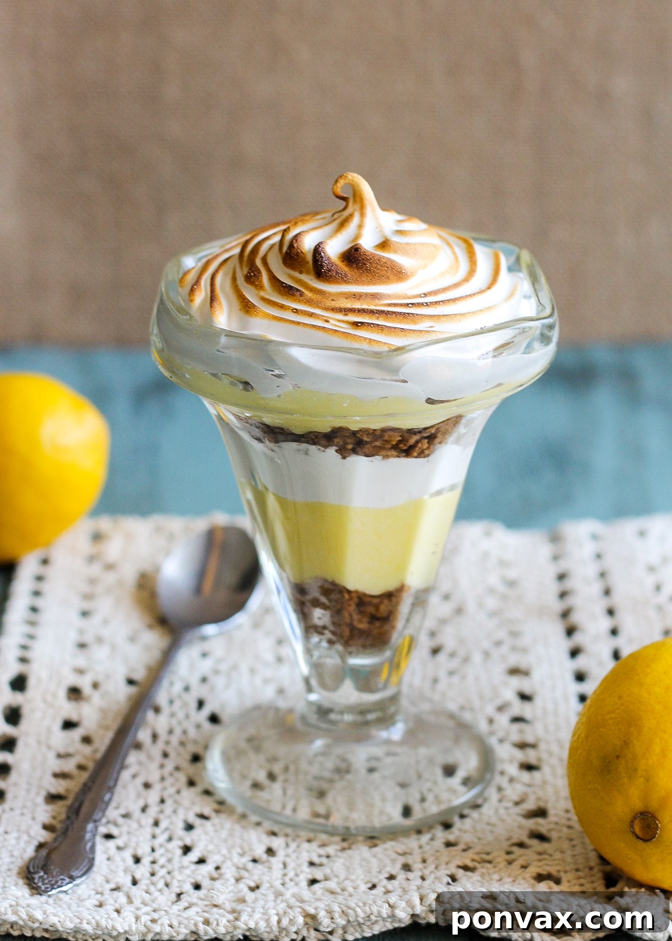 These Lemon Meringue Pie Parfaits are a no-bake dessert that will be your new summer favorite! Lemon curd, graham cracker crumbs, and meringue makes the best individual treats.