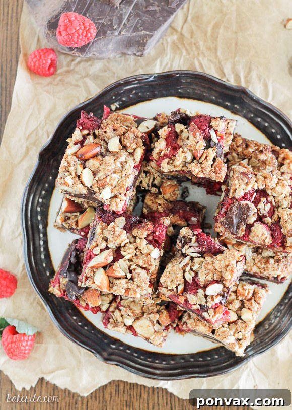 Gluten-Free Vegan Raspberry Chocolate Chunk Delights 5 These Raspberry Chocolate Chunk Bars have a crust that doubles as a crumble topping and are loaded with raspberries, dark chocolate, and almonds. This easy recipe is gluten free, refined sugar free, and vegan!