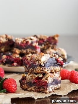 Gluten-Free Vegan Raspberry Chocolate Chunk Delights 6 These Raspberry Chocolate Chunk Bars have a crust that doubles as a crumble topping and are loaded with raspberries, dark chocolate, and almonds. This easy recipe is gluten free, refined sugar free, and vegan!