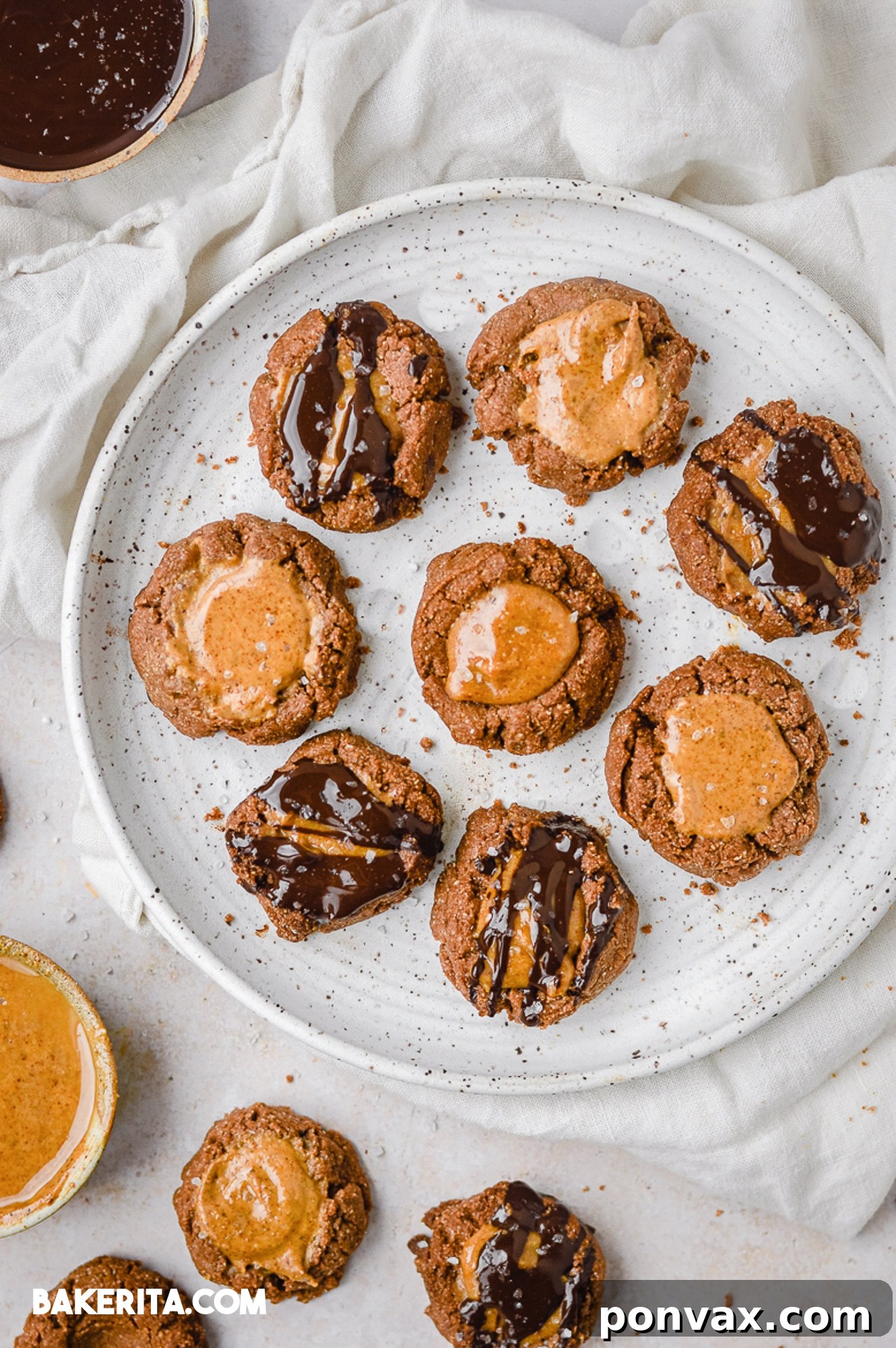 Healthy Chocolate Almond Butter Thumbprint Cookies – a festive, wholesome treat for any occasion. Vegan, paleo, gluten-free, and refined sugar-free!