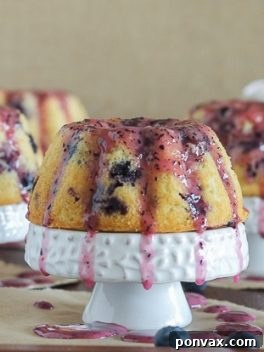 Mini Lemon Blueberry Bundt Cakes with a delicious blueberry glaze.
