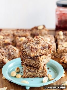 Gluten-Free Vegan Peanut Butter & Jelly Bars with a golden crumb topping