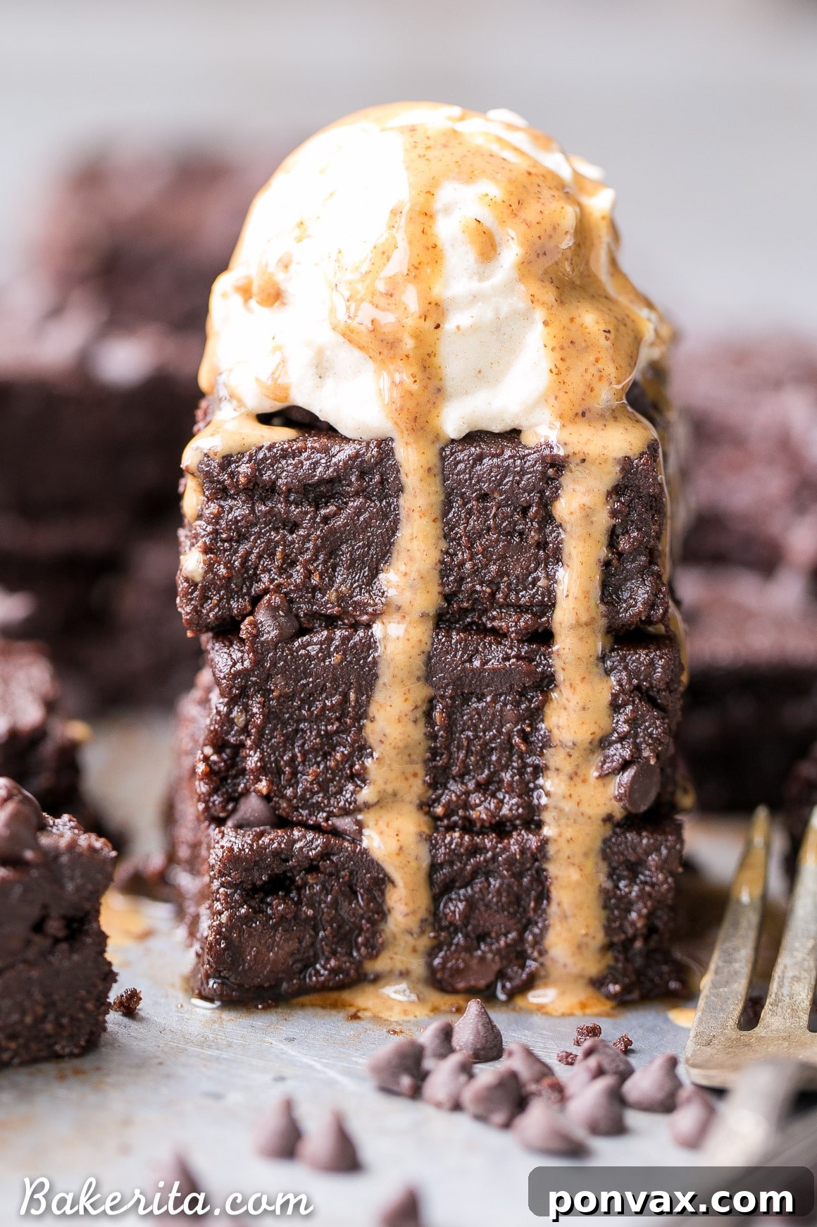 Close-up of freshly baked Ultimate Gluten-Free Fudge Brownies with a glossy, rich chocolate frosting