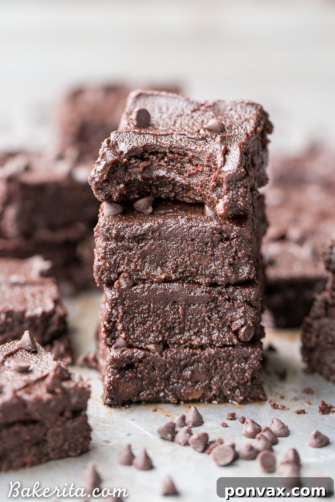 Stack of rich, fudgy gluten-free brownies with a luxurious paleo chocolate ganache frosting