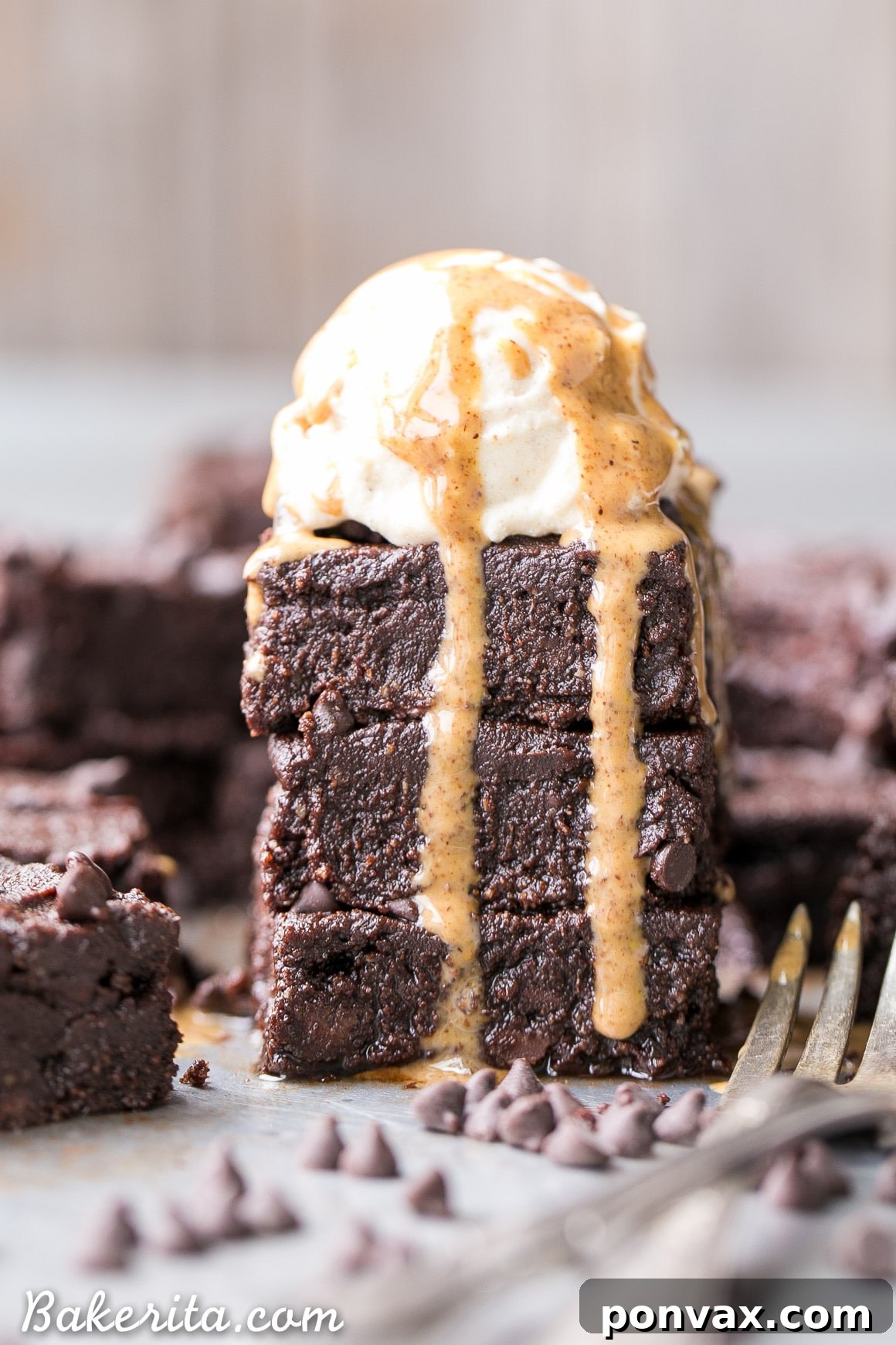 Close-up shot of a rich, frosted gluten-free fudge brownie square on a plate