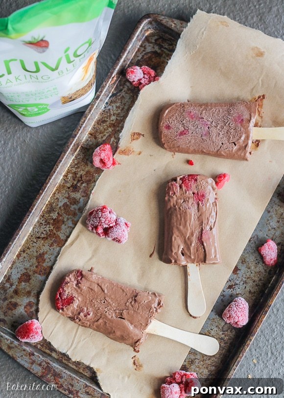These Chocolate Raspberry Popsicles are a refreshing frozen chocolate treat to enjoy on a hot day. These pops, filled with raspberries, are also vegan!