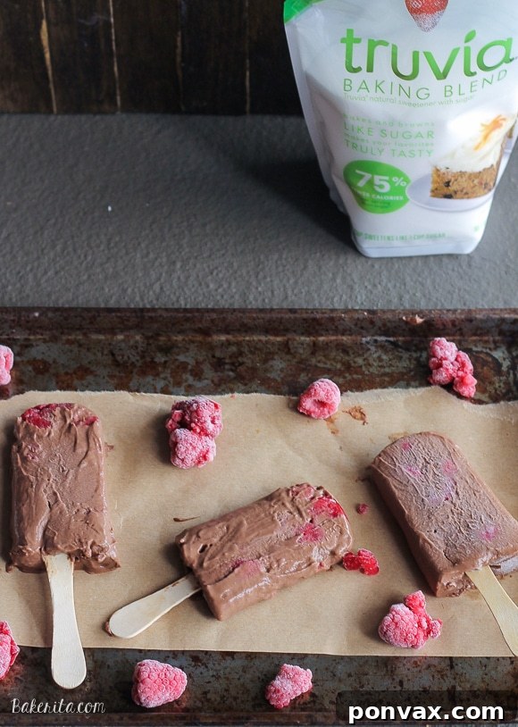 These Chocolate Raspberry Popsicles are a refreshing frozen chocolate treat to enjoy on a hot day. These pops, filled with raspberries, are also vegan!