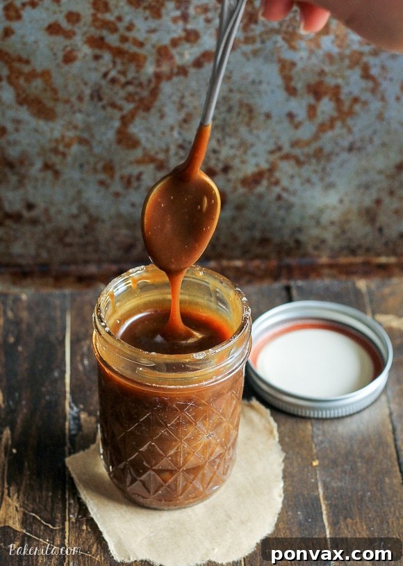 Creamy Paleo Caramel Indulgence 2 A jar of luscious, golden Paleo Caramel Sauce, rich and inviting, made with coconut milk and coconut sugar.