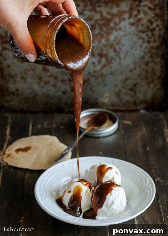 Creamy Paleo Caramel Indulgence 3 Close-up shot of the Paleo Caramel Sauce being stirred in a saucepan, showing its smooth, thick texture and golden-brown color.