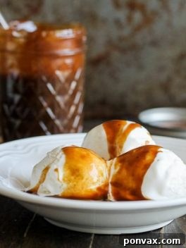 The finished Paleo Caramel Sauce in a jar, ready for use as a refined sugar-free and vegan topping.