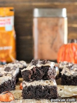 Autumn Spiced Latte Brownies 6 Prepared Pumpkin Spice Latte Brownies with white frosting, garnished with chocolate