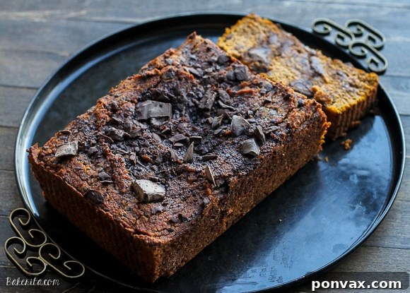 Overhead view of a beautifully baked Paleo Chocolate Chip Pumpkin Bread loaf, ready for slicing.