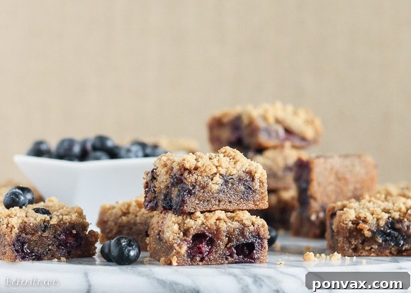 Sliced Blueberry Crumb Blondies showing the soft, fudgy interior and juicy blueberries