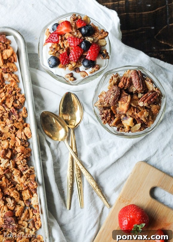 Perfectly clumpy and crunchy Paleo Granola, featuring nuts, coconut, and egg whites for superior texture. It's a gluten-free, refined sugar-free, and dairy-free breakfast or snack.