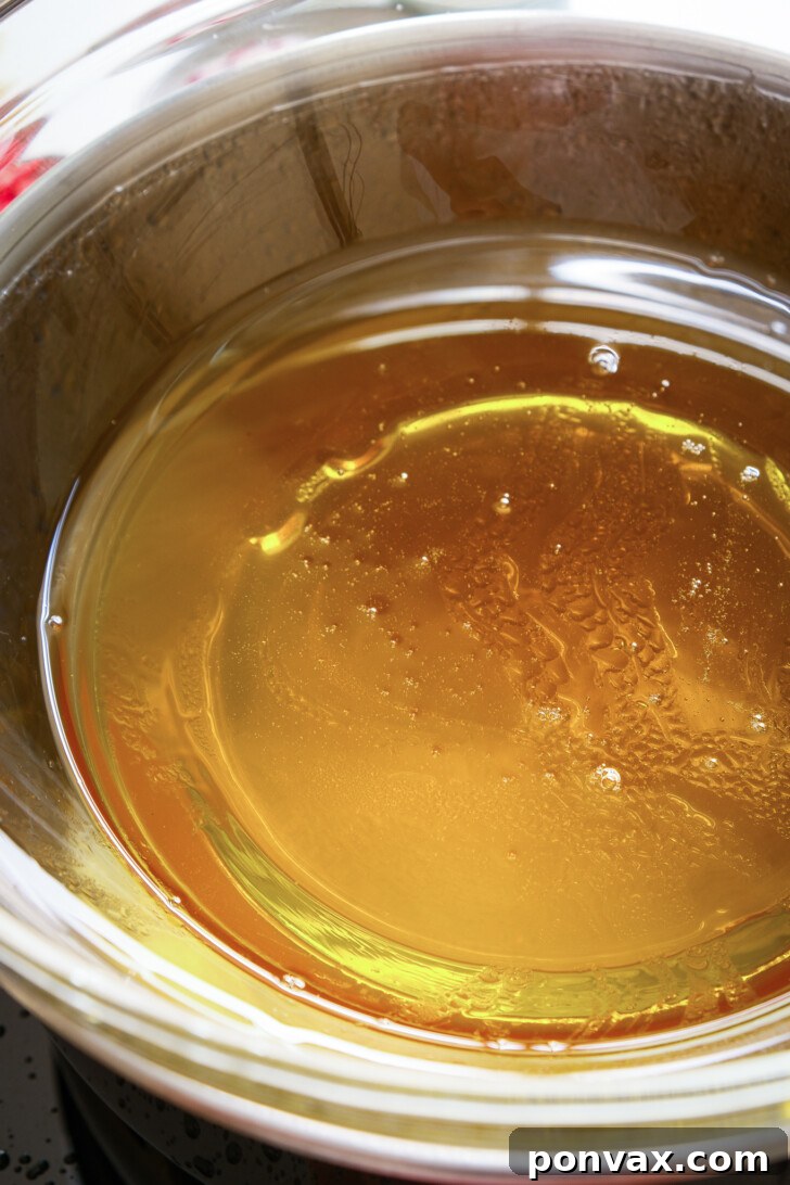 Step-by-step image of adding cocoa powder to melted base.