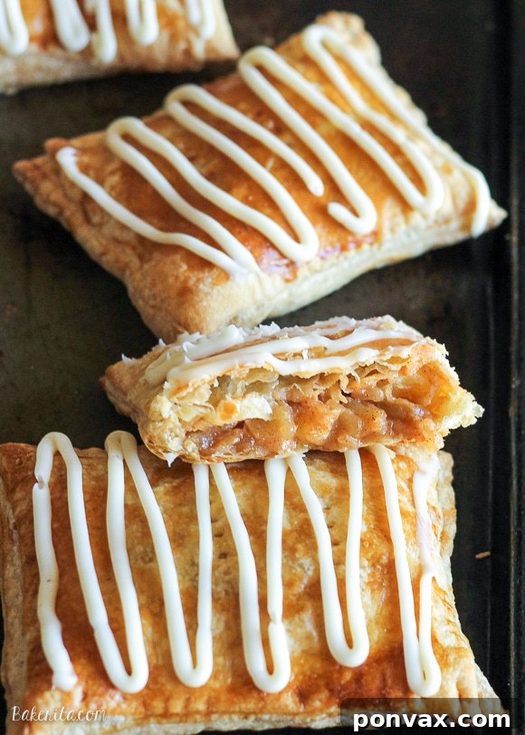 Freshly baked Caramel Apple Toaster Strudels cooling on a wire rack, ready for the cream cheese glaze.