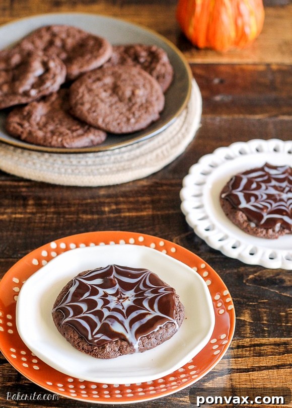 Exquisite Chocolate Spiderweb Cookies 2 These Ultimate Chocolate Spiderweb Cookies are perfect for Halloween! They're double chocolate cookies, full of chocolate chunks, and topped with white and dark chocolate ganache.