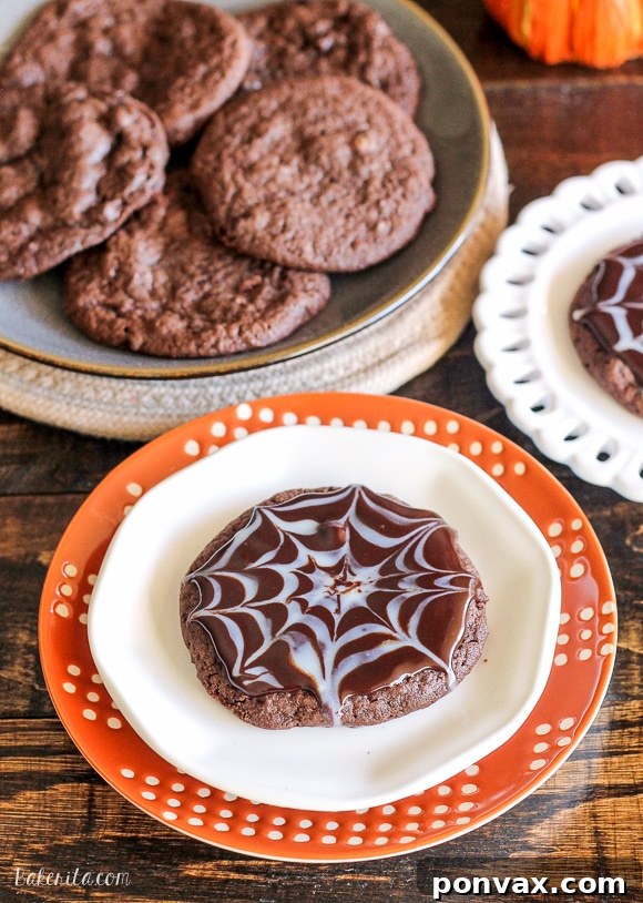 Exquisite Chocolate Spiderweb Cookies 5 These Ultimate Chocolate Spiderweb Cookies are perfect for Halloween! They're double chocolate cookies, full of chocolate chunks, and topped with white and dark chocolate ganache.