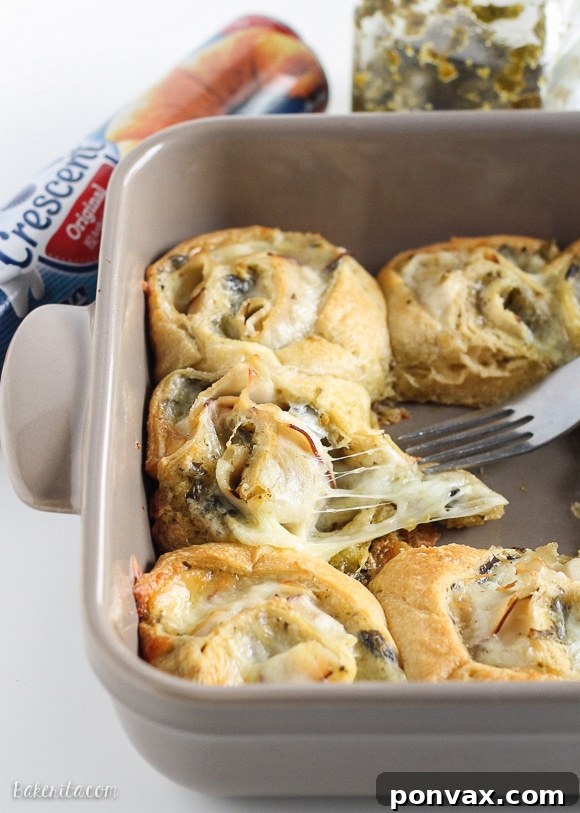Cheesy Turkey Pesto Pinwheels 4 Hands reaching for a platter of freshly baked Cheesy Turkey Pesto Rolls, showcasing the perfect golden crust and melted cheese, ready for serving.