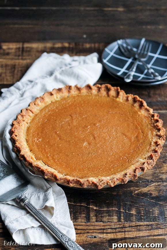 Super creamy and healthy Paleo Pumpkin Pie, perfect for a gluten-free, refined sugar-free, and dairy-free holiday dessert or breakfast.