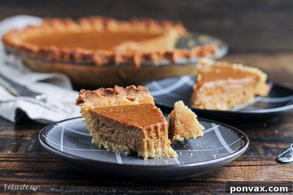 Close-up of a slice of healthy Paleo Pumpkin Pie, suitable for breakfast, showcasing its creamy texture.
