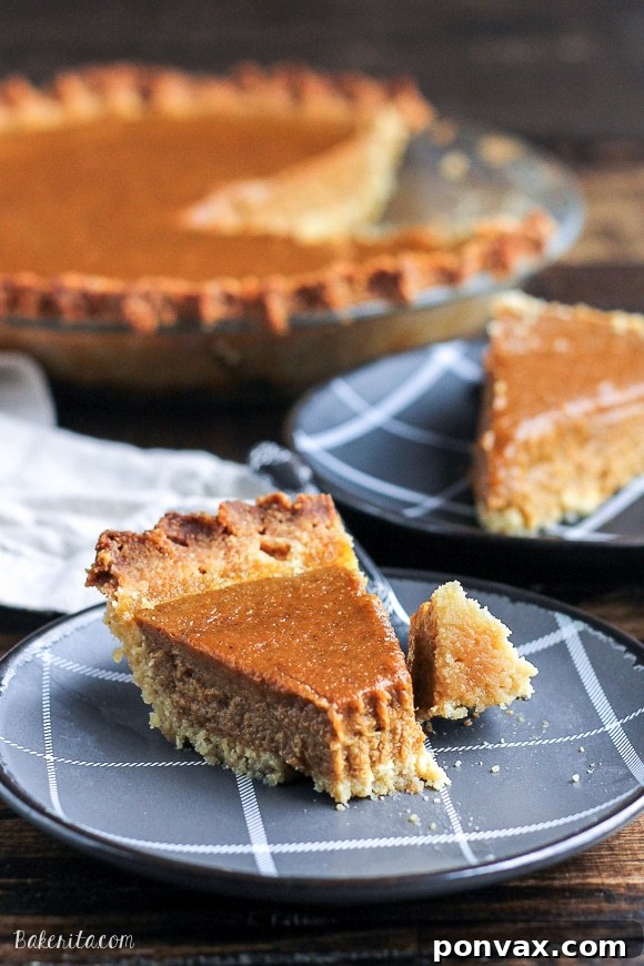 A whole Paleo Pumpkin Pie on a wooden surface, emphasizing its natural and wholesome ingredients.