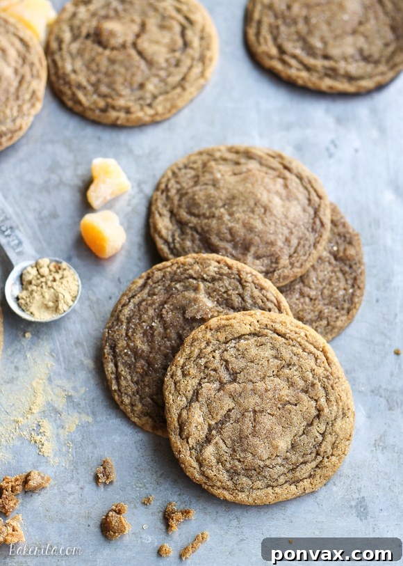 Stacked chewy ginger orange cookies with visible crackled sugar-coated tops