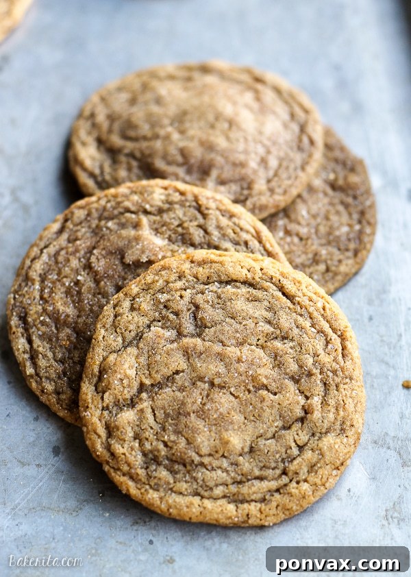 Close-up of soft chewy ginger orange cookies showcasing crinkled tops and golden edges